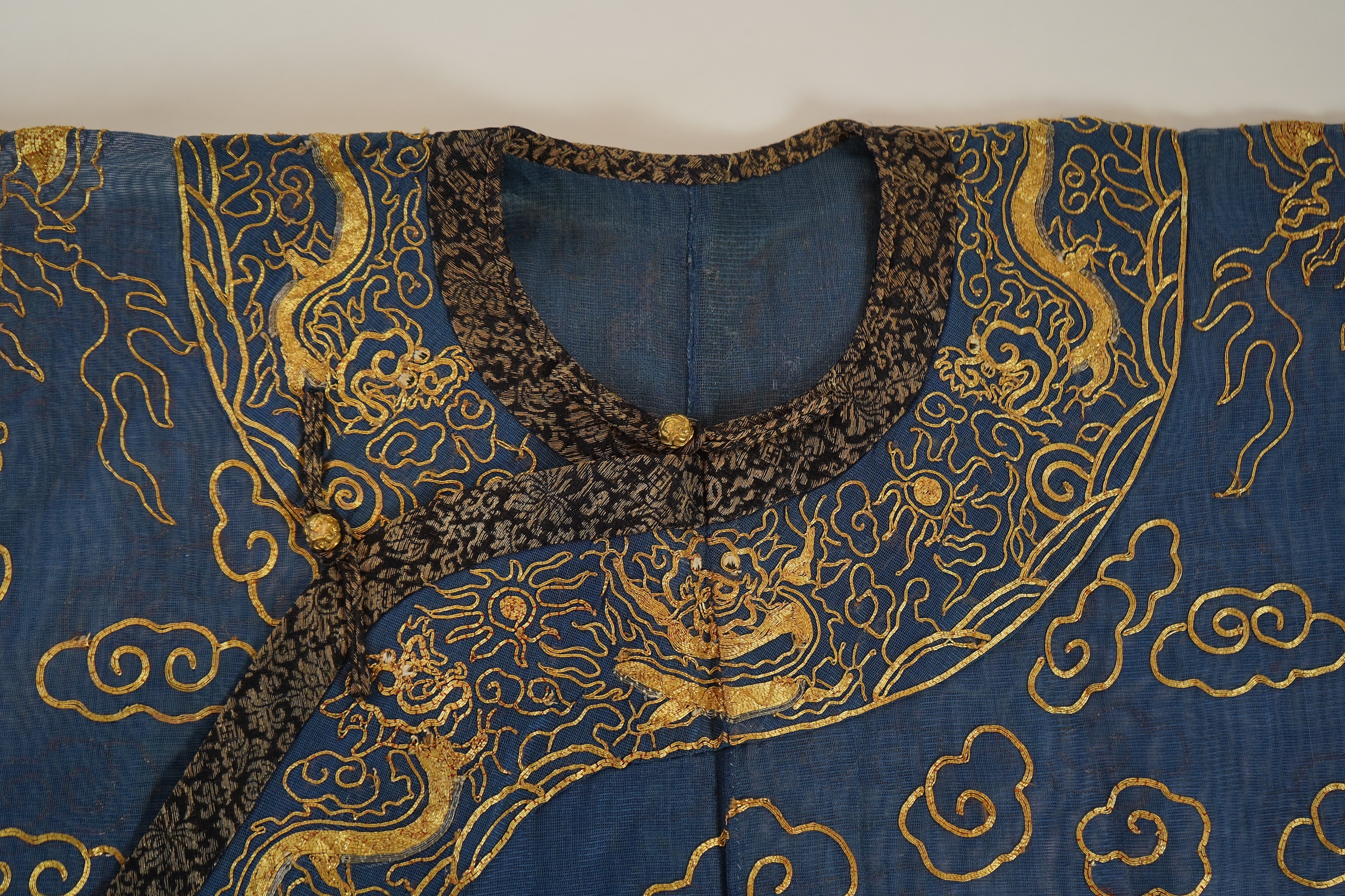 A Chinese gold thread and silk gauze ‘dragon’ summer robe, jifu, early 20th century